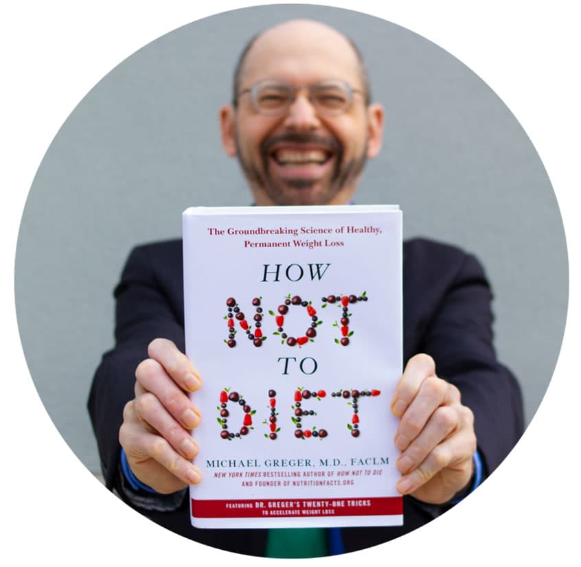 Picture of Michael Greger holding How Not to Diet